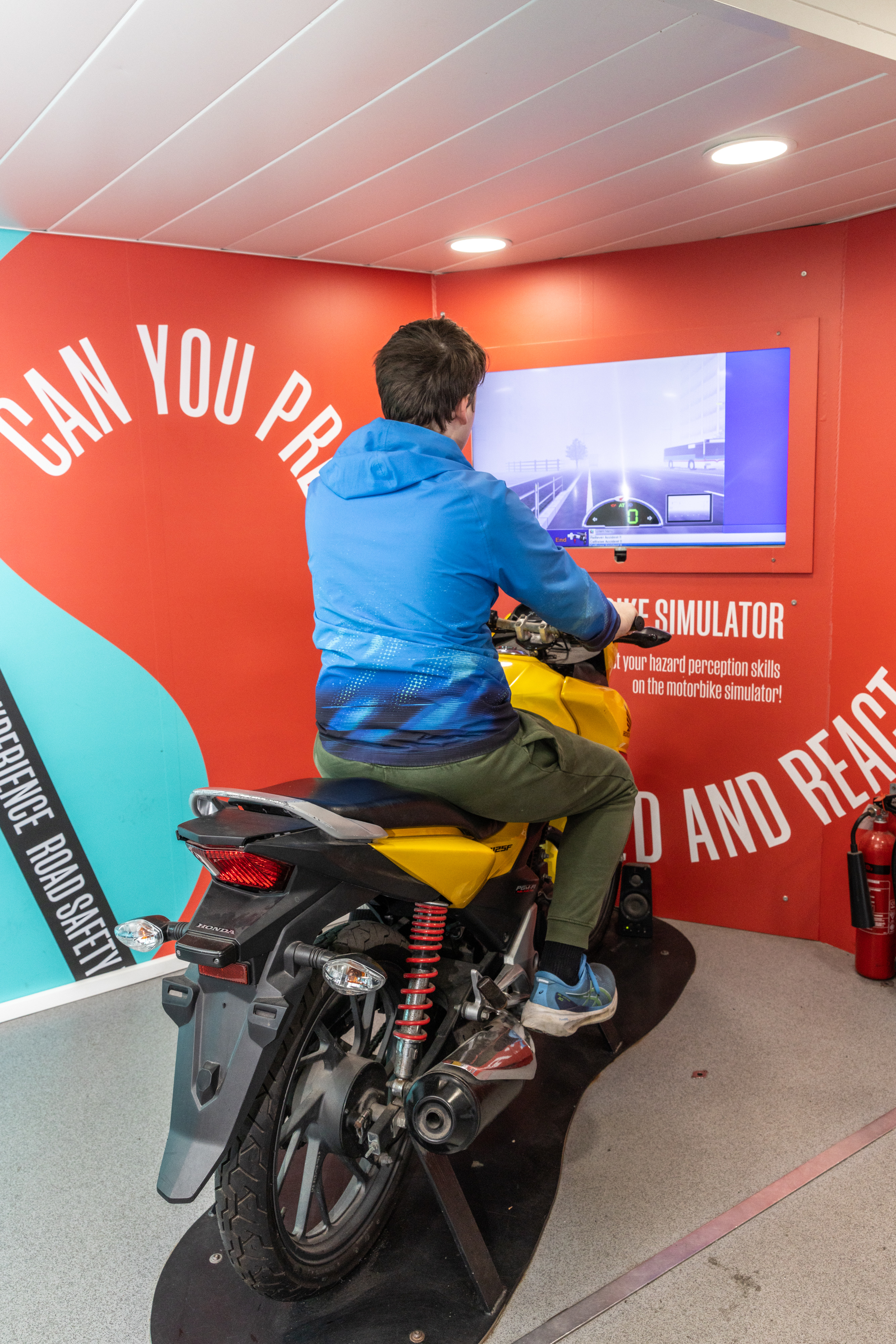Person playing a motorcycle video game.